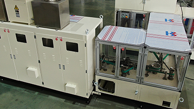 Integrated stackers and baggers for sanitary napkins, pantyliners
